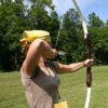 Woman with bow and arrow at team buidling activity