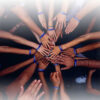 group in a circle with hands