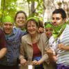 Group of people with green bandanas
