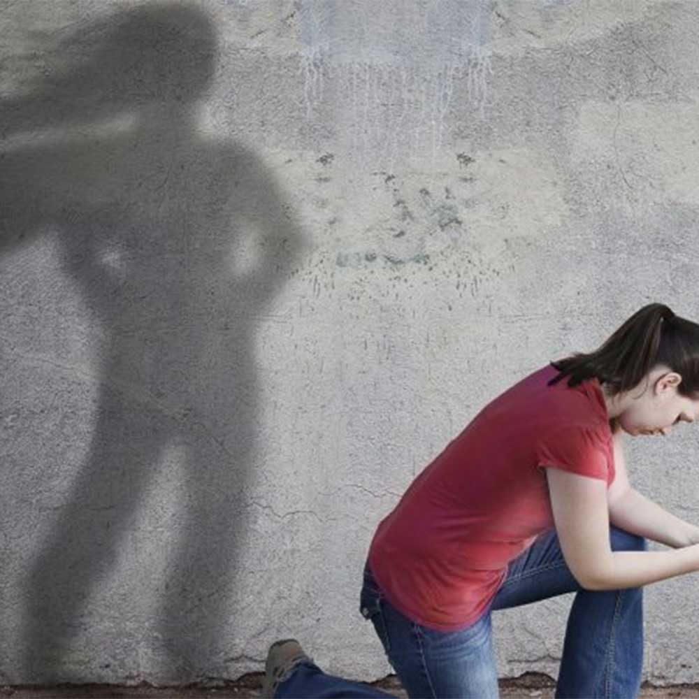 young-girl-kneeling-down-with-a-superhero-shadow