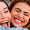 Women Hugging smiling and laughing