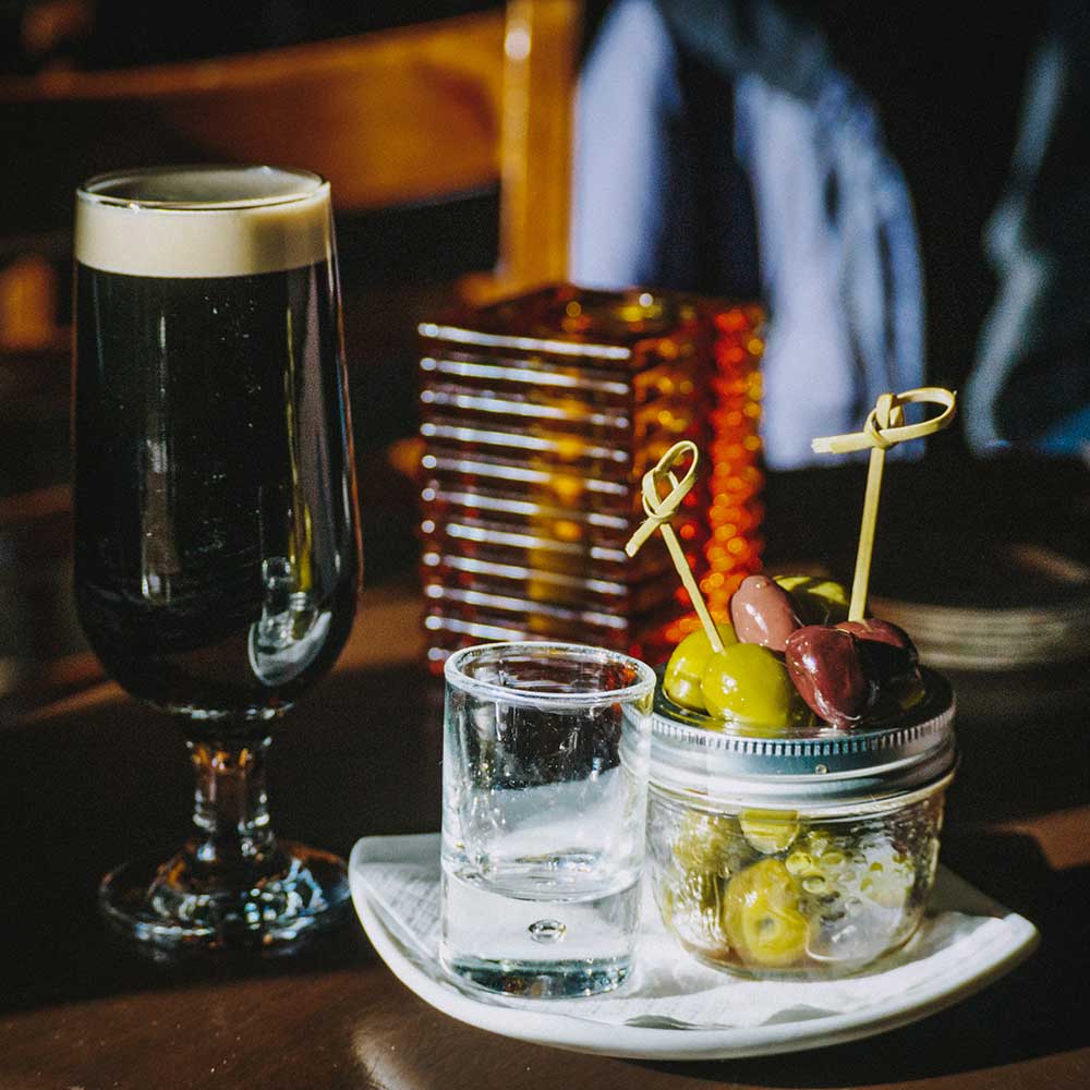 Beer glass and cocktail of olives