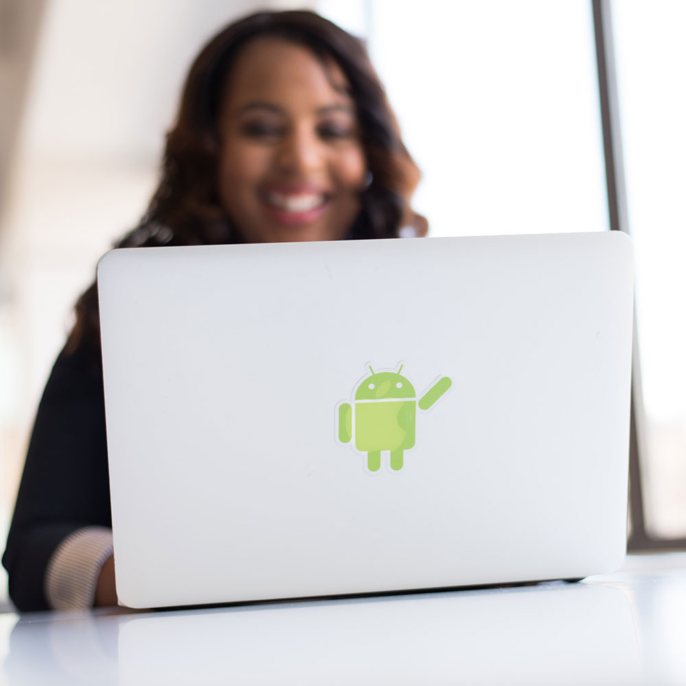 woman with android logo on laptop