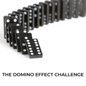 Domino pieces arranged and in the process of toppling down