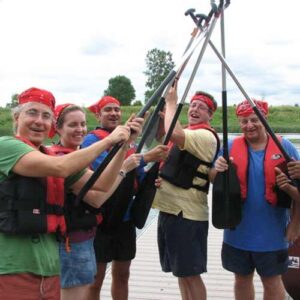 Group of diverse people wearing life jacket and pirate-like costume with props