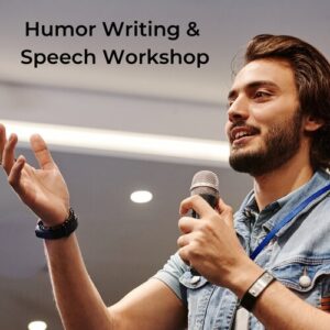 Man talking into the microphone in public closed area delivering a humor writing and speech workshop
