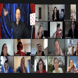 Group of diverse people in a video call virtual meeting watching a magic performance